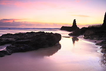 Image showing Sunrise reflections in tidal wet sands Jones Beach Kiama