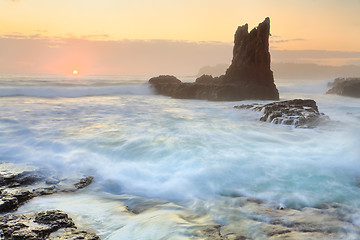 Image showing Sun glimpses over the horizon at Cathedral Rock Kiama