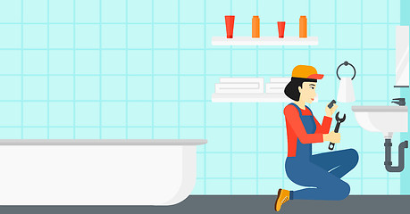 Image showing Woman repairing sink.