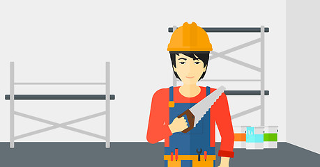 Image showing Smiling worker with saw.