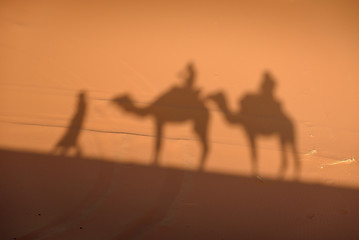 Image showing Camel shadows on Sahara Desert sand in Morocco.