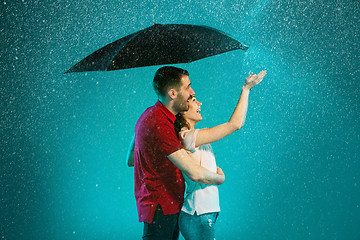 Image showing The loving couple in the rain