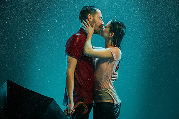 Image showing The loving couple in the rain