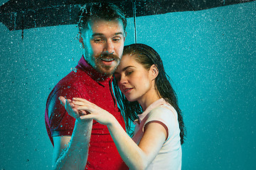 Image showing The loving couple in the rain