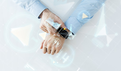 Image showing hand with smartwatch and virtual screen projection