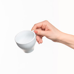 Image showing Woman hand with cup on white background