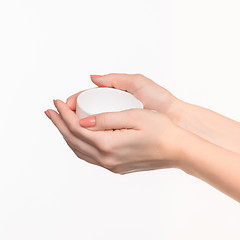 Image showing Woman hand with cup on white background