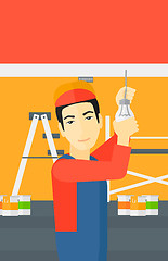 Image showing Electrician twisting light bulb.