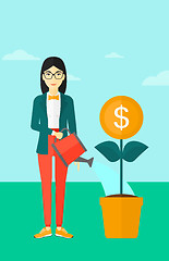 Image showing Woman watering money flower.