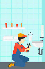 Image showing Man repairing sink.