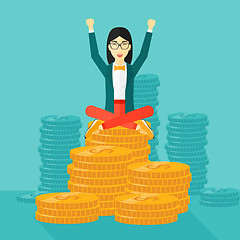 Image showing  Happy business woman sitting on coins.