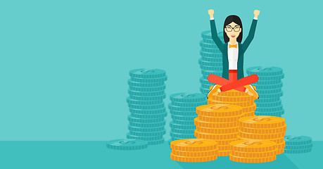 Image showing  Happy business woman sitting on coins.