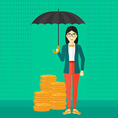 Image showing Woman with umbrella protecting money.