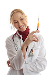 Image showing Physician or vet holding needle syringe