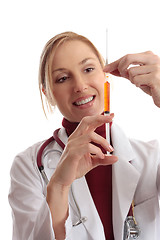 Image showing Doctor preparing needle