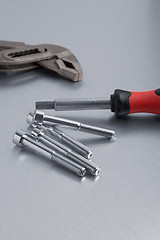 Image showing Spanner tool and screws