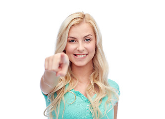 Image showing happy young woman pointing finger to you