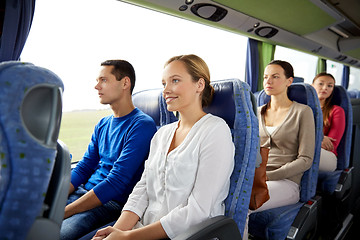 Image showing group of happy passengers in travel bus