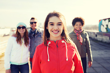 Image showing group of happy teenage friends on city street