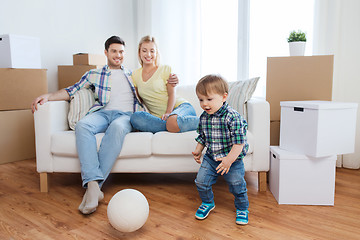 Image showing happy family moving to new home and playing ball