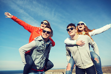 Image showing happy friends in shades having fun outdoors