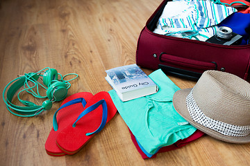 Image showing close up of travel bag with clothes and stuff