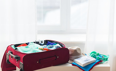 Image showing close up of travel bag with clothes and stuff