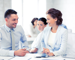 Image showing usiness colleagues talking in office