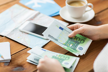 Image showing close up of traveler hands counting euro money