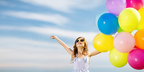 Image showing happy girl with colorful balloons