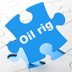 Image showing Manufacuring concept: Oil Rig on puzzle background
