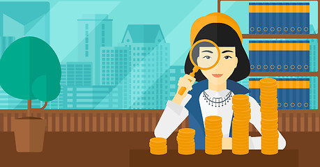 Image showing Woman with magnifier and golden coins. 