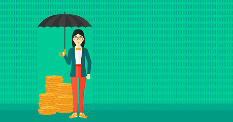 Image showing Woman with umbrella protecting money.