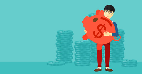 Image showing Man carrying piggy bank.