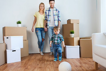 Image showing happy family moving to new home and playing ball