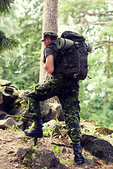 Image showing young soldier with backpack in forest