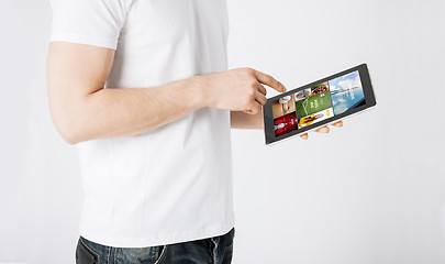 Image showing close up of man with tablet pc and web pages