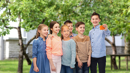 Image showing happy children talking selfie by smartphone