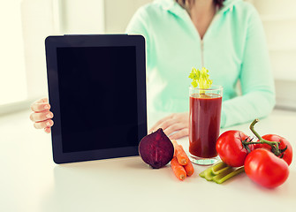 Image showing close up of woman with tablet pc and vegetables