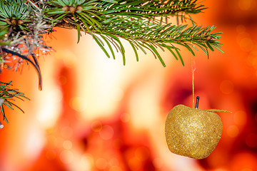 Image showing Christmas tree with a shiny apple