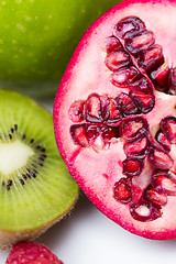 Image showing close up of ripe pomegranate and kiwi