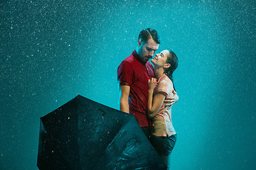 Image showing The loving couple in the rain