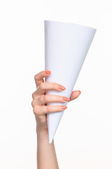 Image showing The cone in female hands on white background