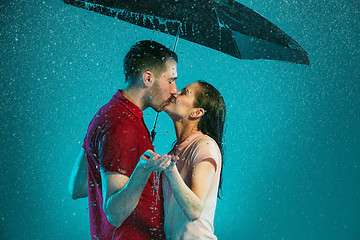 Image showing The loving couple in the rain