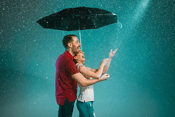 Image showing The loving couple in the rain