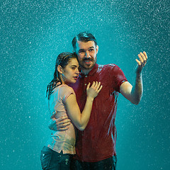 Image showing The loving couple in the rain