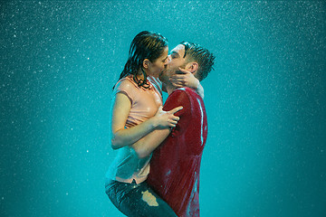 Image showing The loving couple in the rain