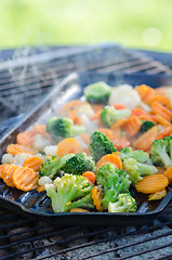 Image showing Vegetables fried on coals, close up. Note: Shallow depth of fiel