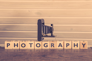 Image showing Vintage camera on a photography sign