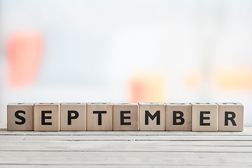 Image showing September sign on a wooden table